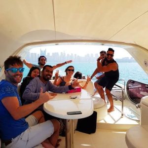 A group of friends enjoys a fun yacht trip